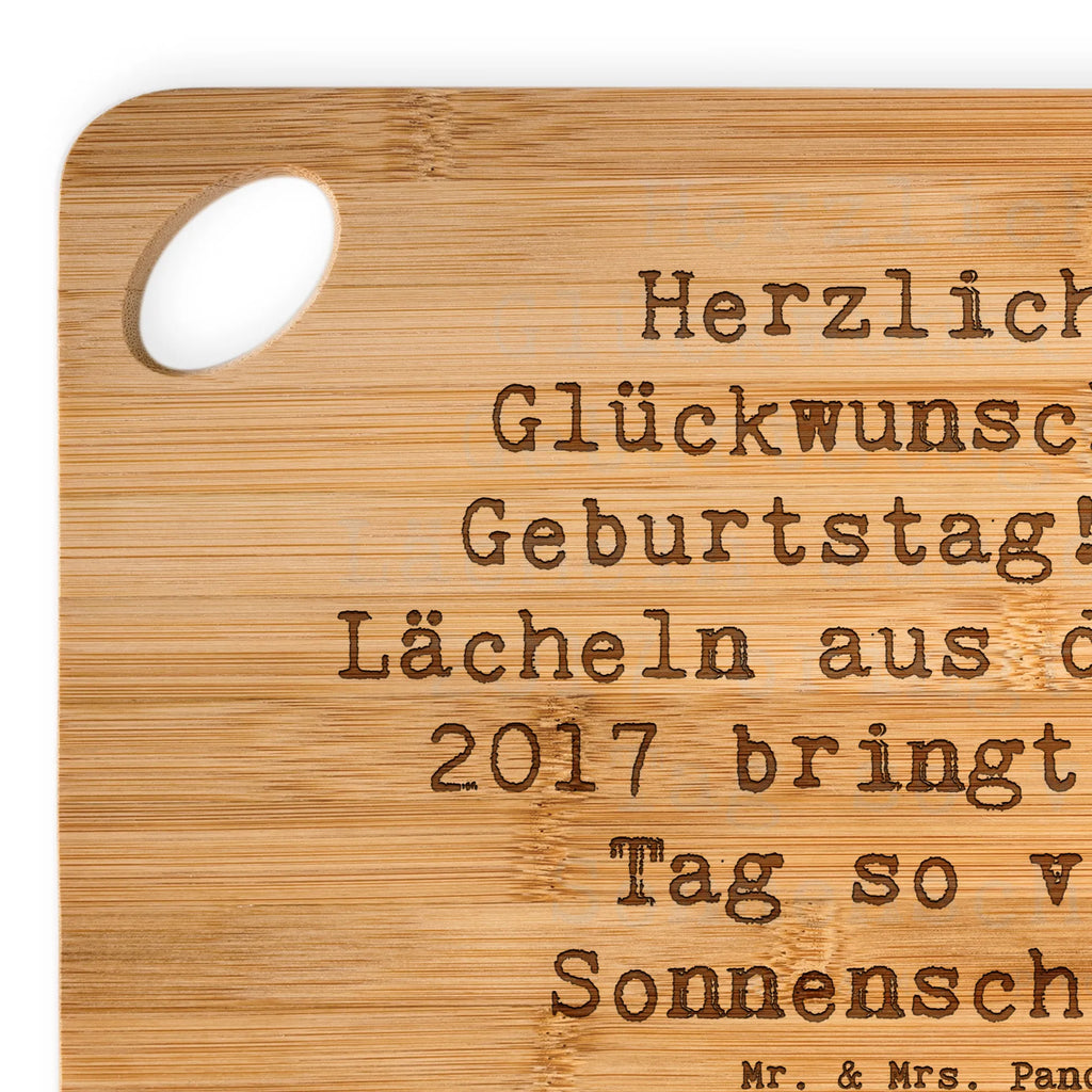 Bamboo chopping board Saying Herzlichen Glückwunsch zum Geburtstag! Dein Lächeln aus dem Jahr 2017 bringt jedem Tag so viel Sonnenschein. cutting board, kitchen, robust, slices, cutting block, nature, kitchen board, breakfast board, engraving, breakfast, board, carving board, bamboo, wood, solid, dulcimer, Birthday, celebration, party, birthday party, friends, family, birthday wish, birthday present, birthday cards, 18th birthday, 30th birthday, 40th, 50th, 60th, 70th, 80th, 90th, 90th., gift ideas, gifts for girlfriend, boyfriend, mom, dad, brother, sister, congratulations, funny, sayings, 1 year, money gifts, guest gifts, gifts online, gift basket, special gifts, unusual gifts, extraordinary gifts, gift package, original gifts, gift items, special birthday gifts