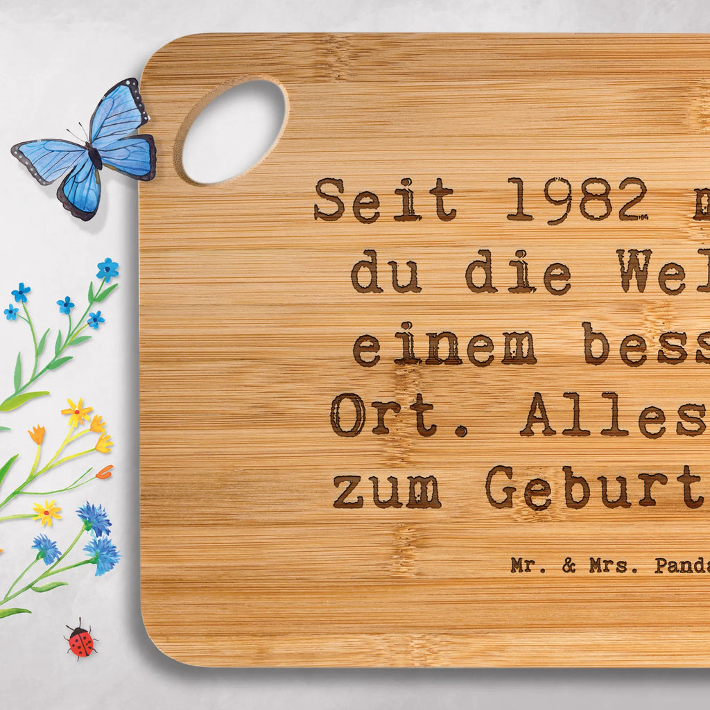Bamboo chopping board Saying Seit 1982 machst du die Welt zu einem besseren Ort. Alles Gute zum Geburtstag! nature, solid, cutting board, carving board, breakfast, robust, kitchen, slices, cutting block, dulcimer, kitchen board, bamboo, wood, board, engraving, breakfast board, Birthday, celebration, party, birthday party, friends, family, birthday wish, birthday present, birthday cards, 18th birthday, 30th birthday, 40th, 50th, 60th, 70th, 80th, 90th, 90th., gift ideas, gifts for girlfriend, boyfriend, mom, dad, brother, sister, congratulations, funny, sayings, 1 year, money gifts, guest gifts, gifts online, gift basket, special gifts, unusual gifts, extraordinary gifts, gift package, original gifts, gift items, special birthday gifts