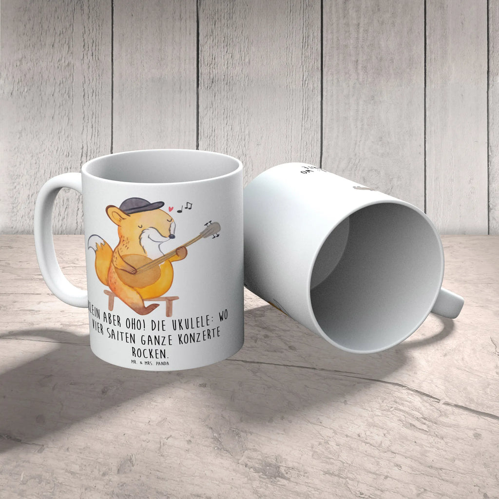 Mug Klein aber oho! Die Ukulele: wo vier Saiten ganze Konzerte rocken. Tasse, Kaffeetasse, Teetasse, Porzellantasse, Bürotasse, Keramiktasse, Geschenktasse, Tasse mit Motiven, Tasse mit Zitaten, Instrumente, Geschenke Musiker, Musikliebhaber